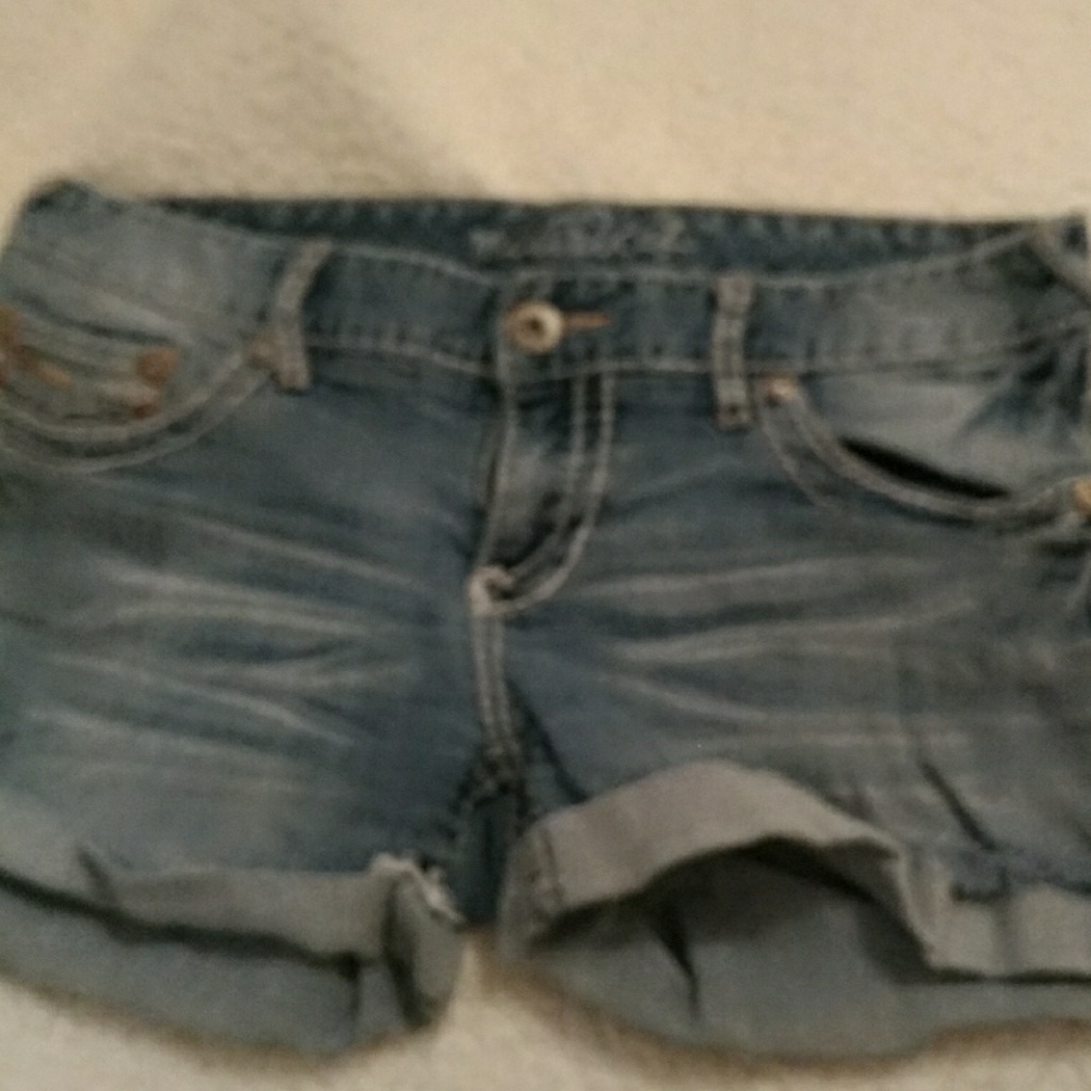Rolled, raw hem, embroidered denim shorts